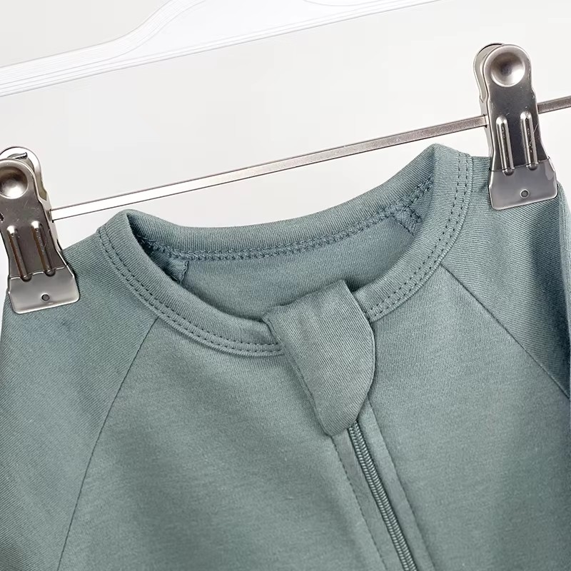 How should baby clothes be washed and stored?